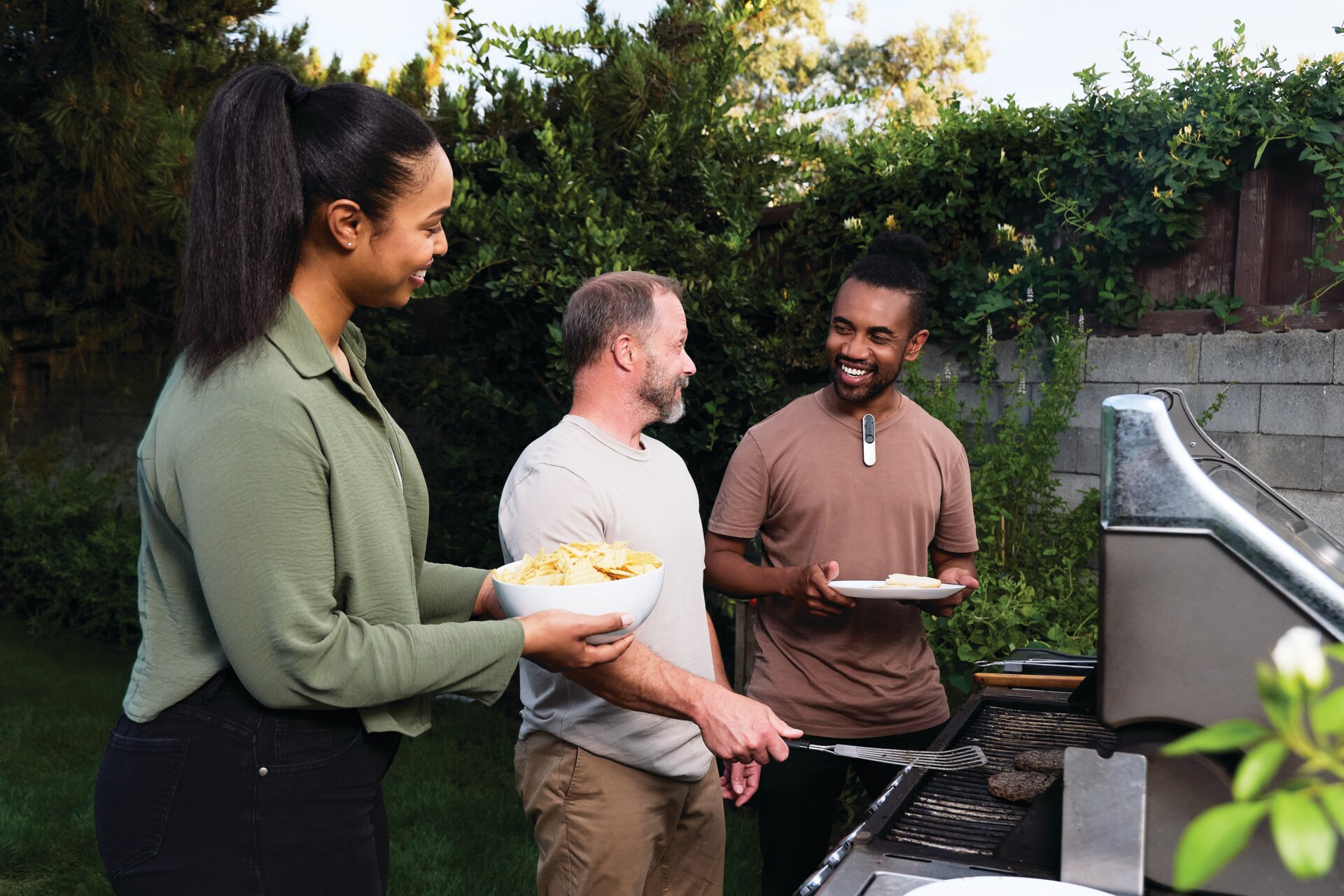 Three veterans at the grill using Phonak Roger On